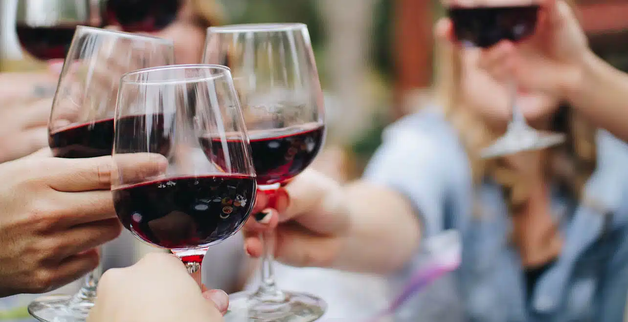 Wine glasses toasting