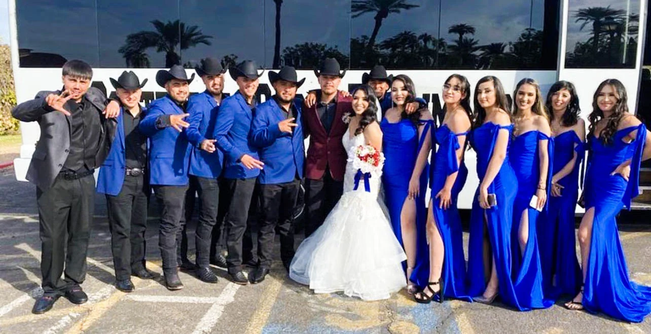 Bride and Groom party in front of party bus