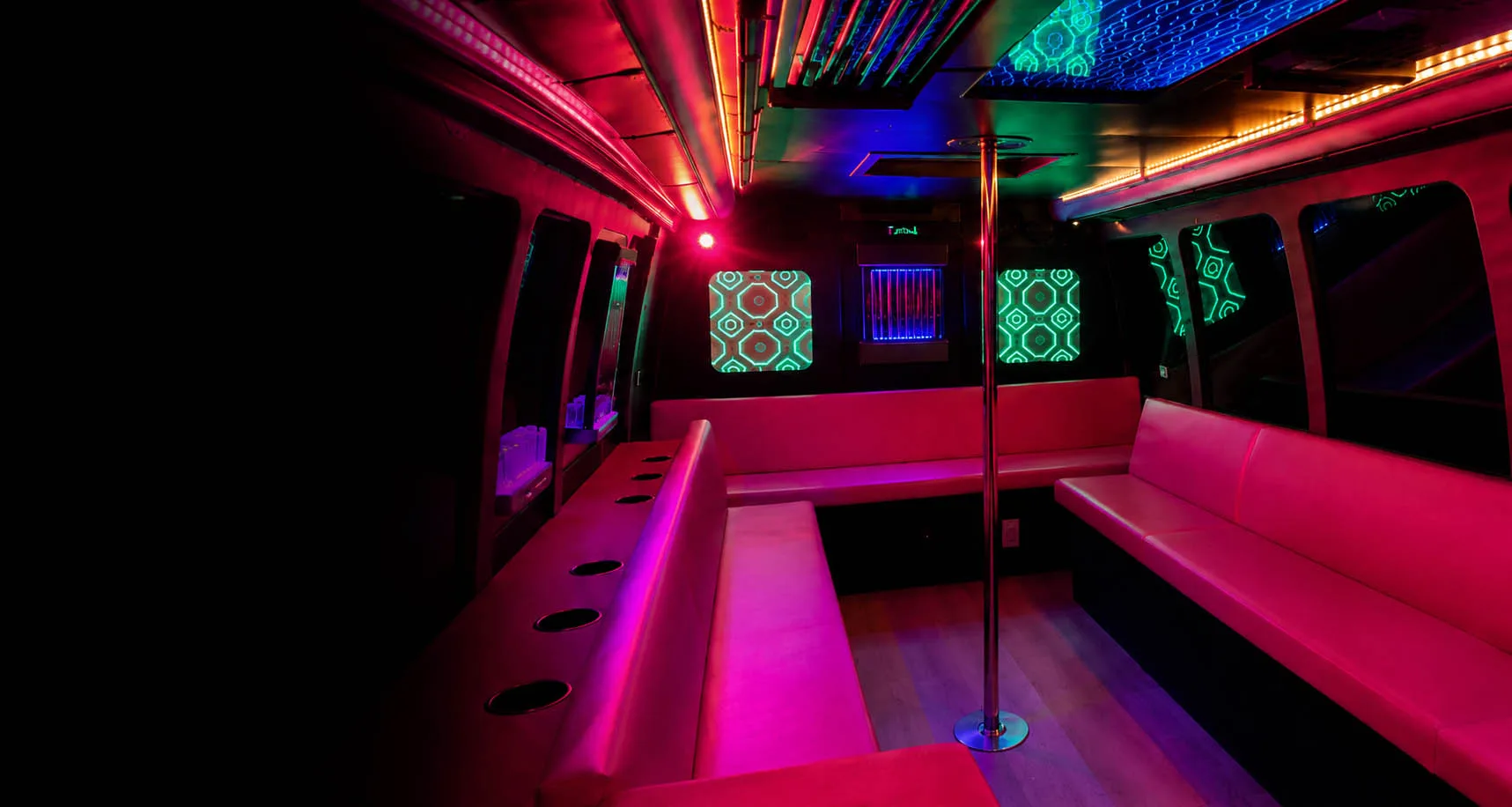 Pink party bus in Scottsdale featuring a luxury pink interior with LED lighting and lounge seating